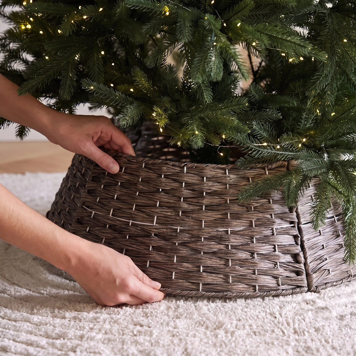 A stylish pvc wood like Christmas tree collar providing a neat and structured base for a lush, realistic christmas tree singapore.
