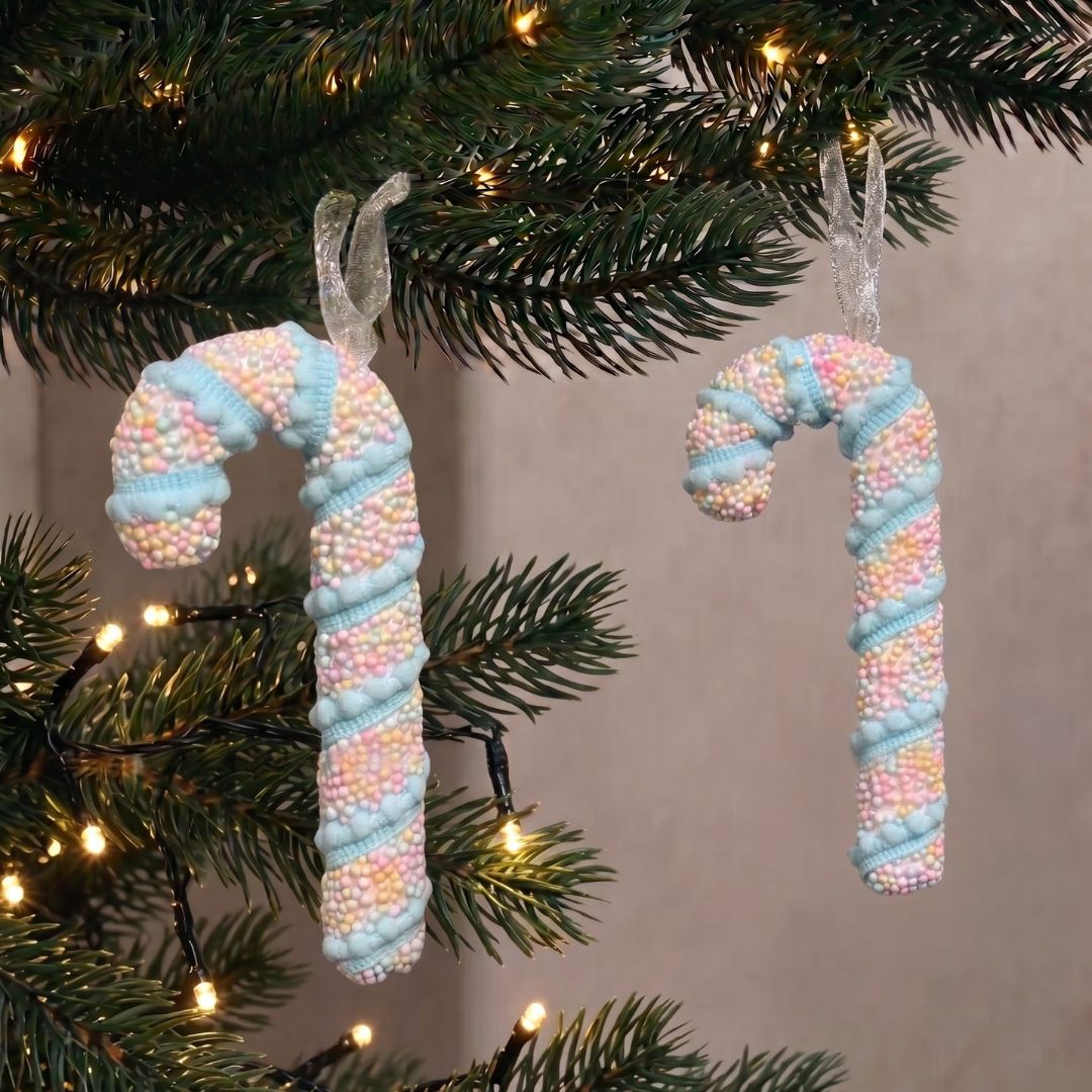 Candyland hanging pastel candy cane ornament with textured sprinkles, styled as a whimsical Christmas decoration in Singapore.