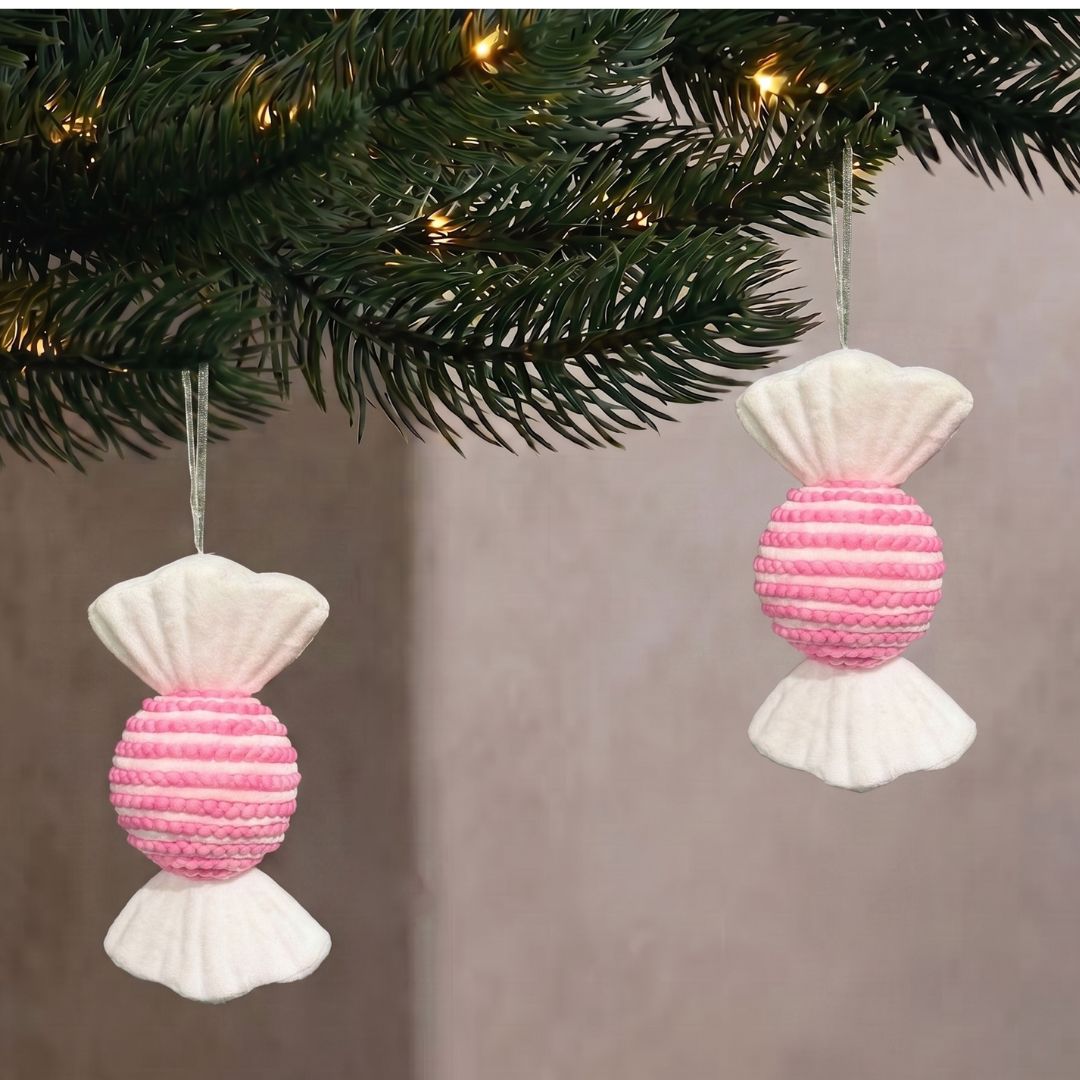Candyland hanging pastel pink wrapped sweet ornament with textured stripes, styled as a whimsical Christmas decoration in Singapore.