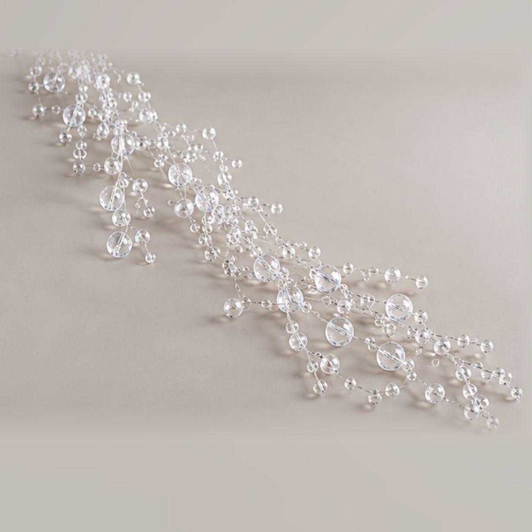 Clear beaded Christmas garland featuring transparent 0.3cm–0.8cm beads cascading from an artificial Christmas tree with warm fairy lights.