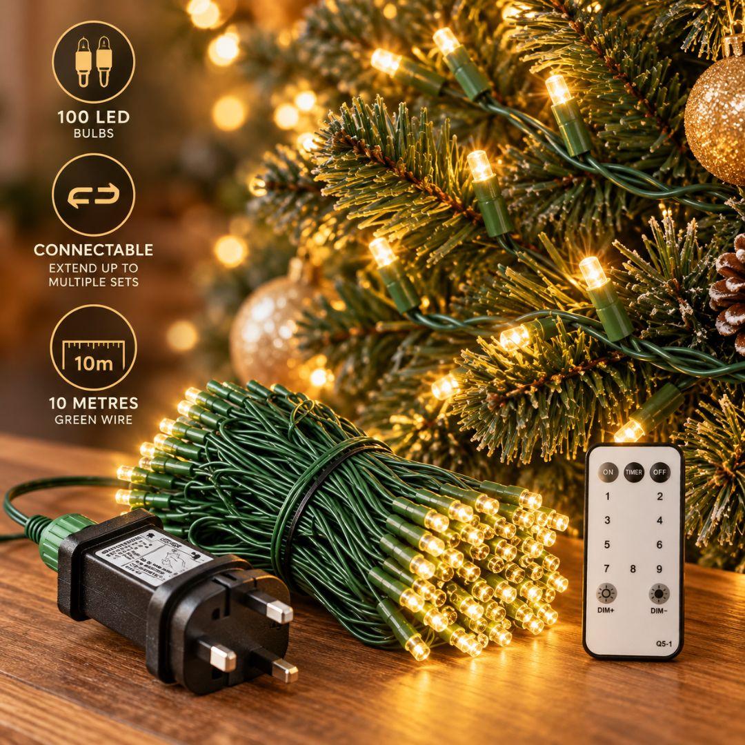 Connectable Christmas LED string lights with 100 bulbs, green wiring, UK 3-pin plug and remote control for Christmas tree decorations.