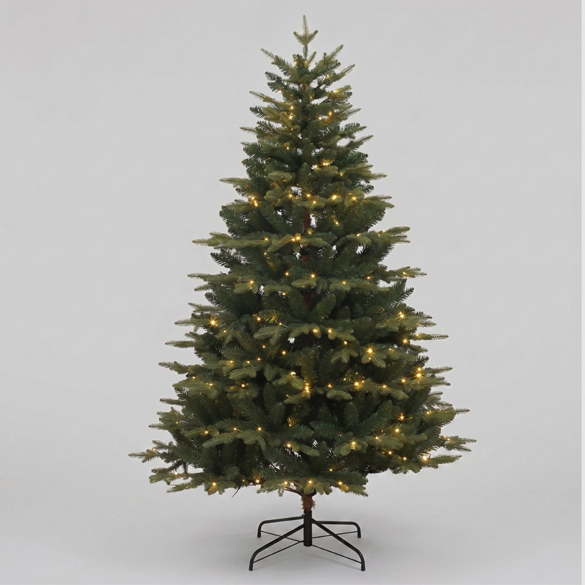 Pre-lit Florentine Fraser Fir Christmas tree featuring warm LED lights and dense foliage by Speckled Space, a premium alternative to Masons Home Decor in Singapore.