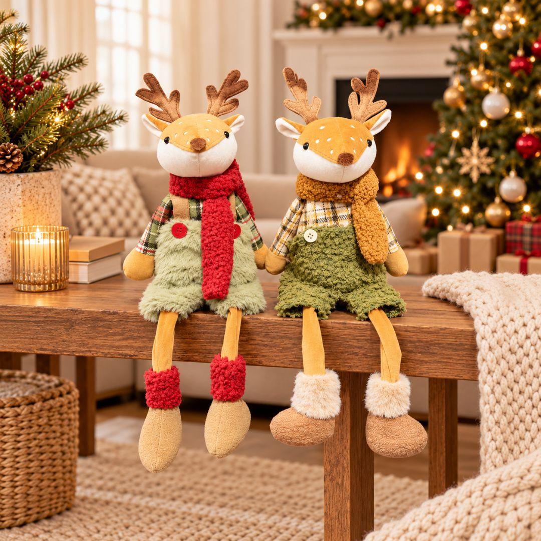 Holly and Hazel sitting Christmas reindeer plush decorations with dangling legs on a wooden table in a festive living room