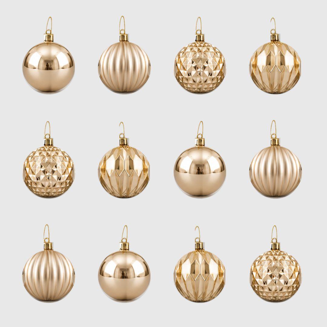 D94 champagne gold Christmas baubles 8cm, set of 12 featuring four assorted reflective, satin ribbed and geometric designs on a light grey background.