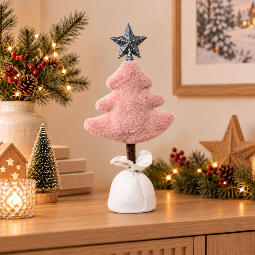 Noel Christmas Plush Design H, 45cm tall blush pink fluffy tabletop Christmas tree featuring a glittery silver star topper, brown trunk and white fabric-wrapped base, displayed on a wooden sideboard.