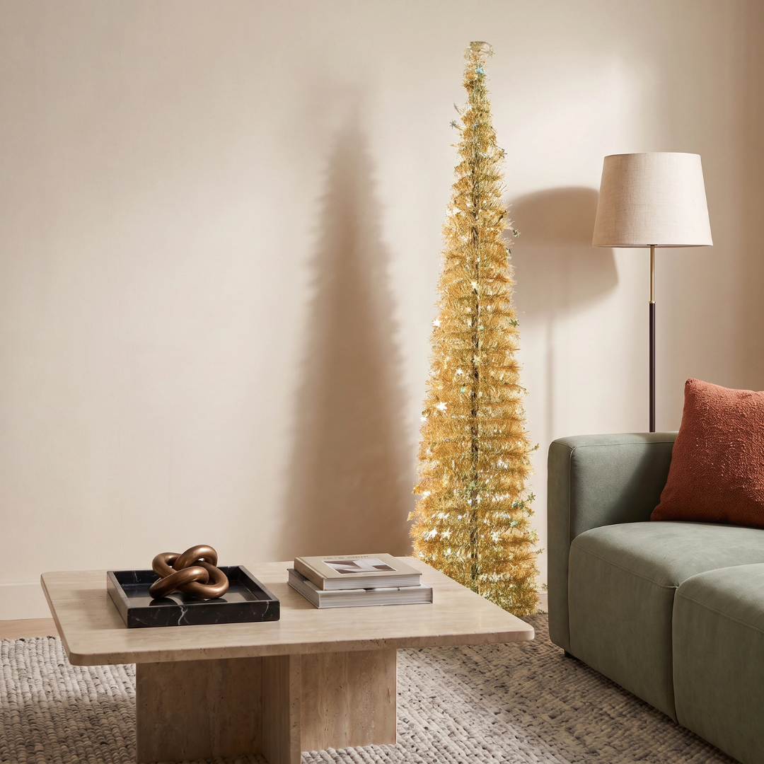 Reinox Gold Tinsel Collapsible Christmas Tree by Speckled Space, featuring a vibrant, space-saving pop-up design that offers a striking, modern alternative to traditional green trees from IKEA Home