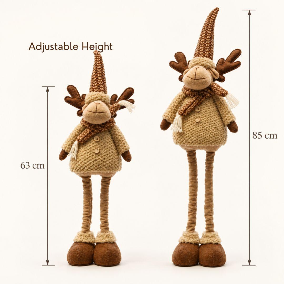 Rowan Nordic adjustable standing Christmas reindeer with tall brown knitted hat, cream textured outfit, antlers and brown plush boots on a cream background