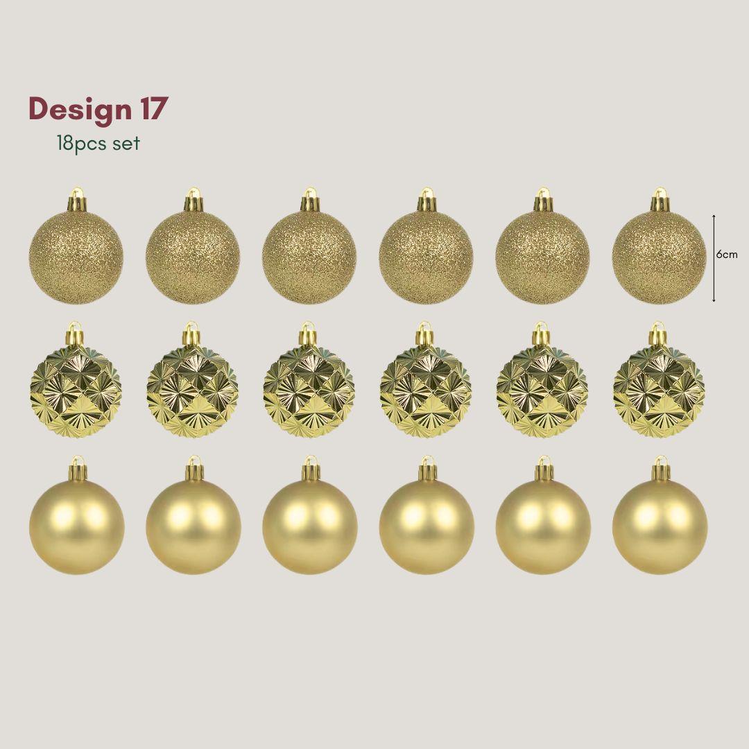 Yuletide Sparkle gold 6cm Christmas baubles in glitter, satin and geometric starburst finishes hanging on an artificial Christmas tree with warm fairy lights.