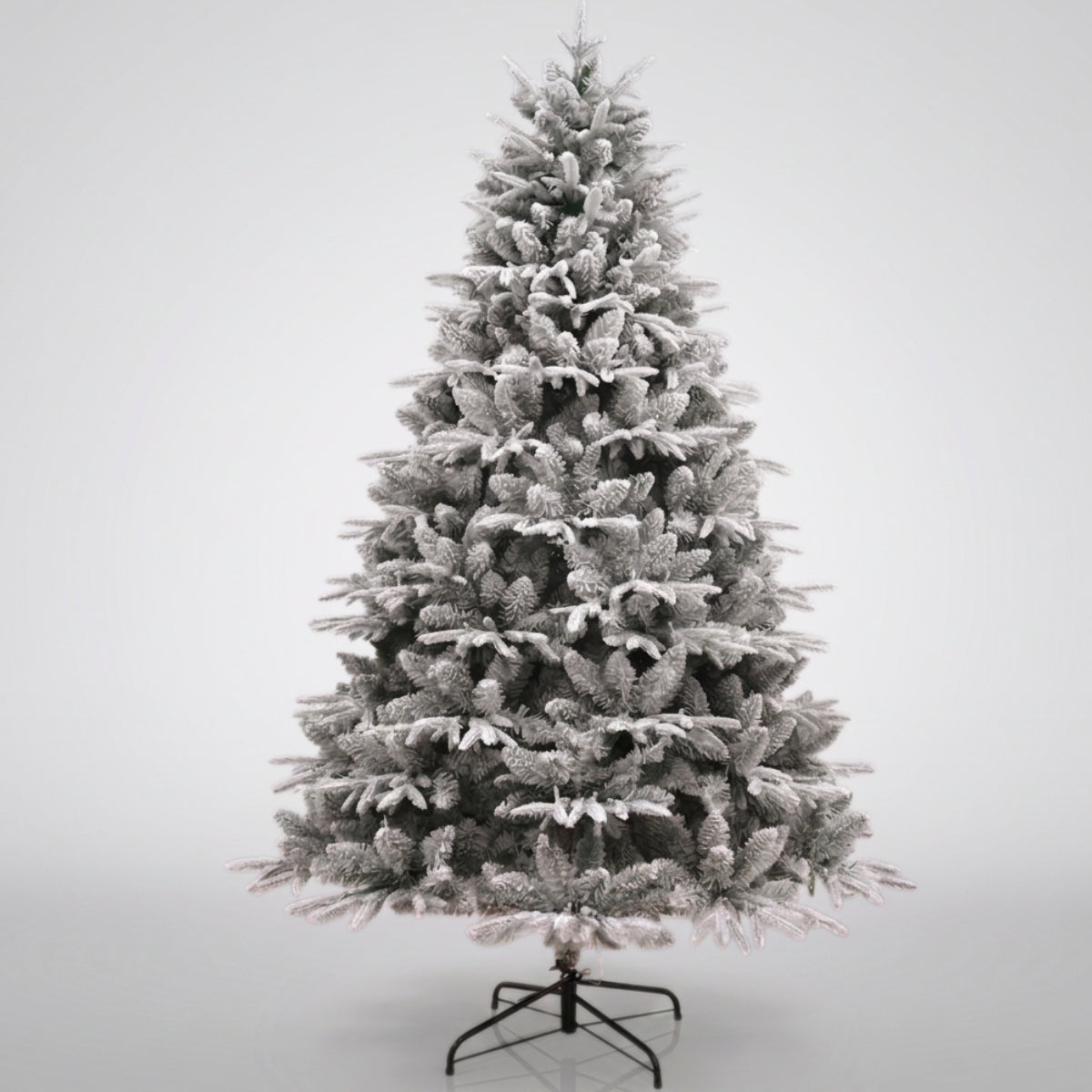 Detailed unlit view of a heavily flocked artificial Christmas tree, showing the dense branches, a top option for a Christmas tree in Singapore.