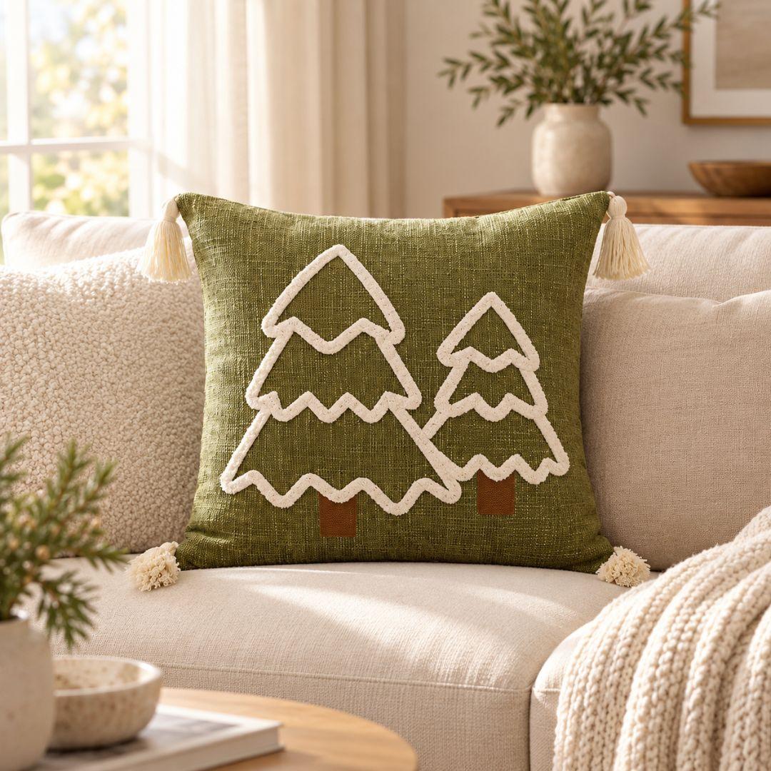 Olive green Alpine Christmas cushion cover with cream Christmas tree embroidery and tassel corners.