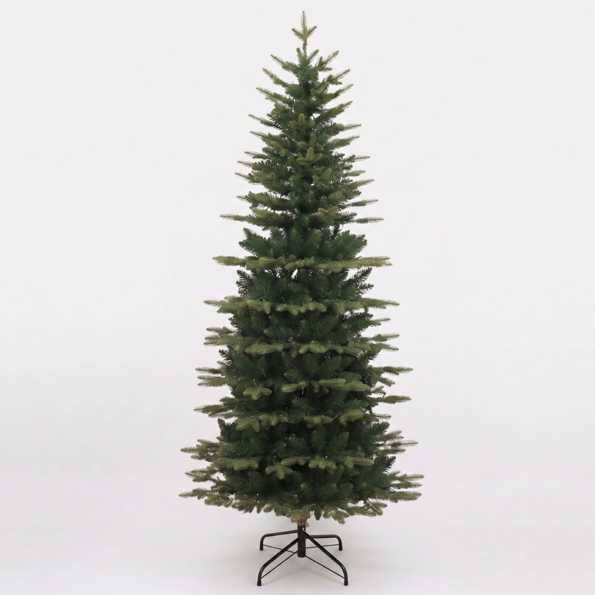 A tall, unlit artificial slim tree on a black stand, a best choice for HDB homes and small homes looking for a quality Christmas Tree Singapore.
