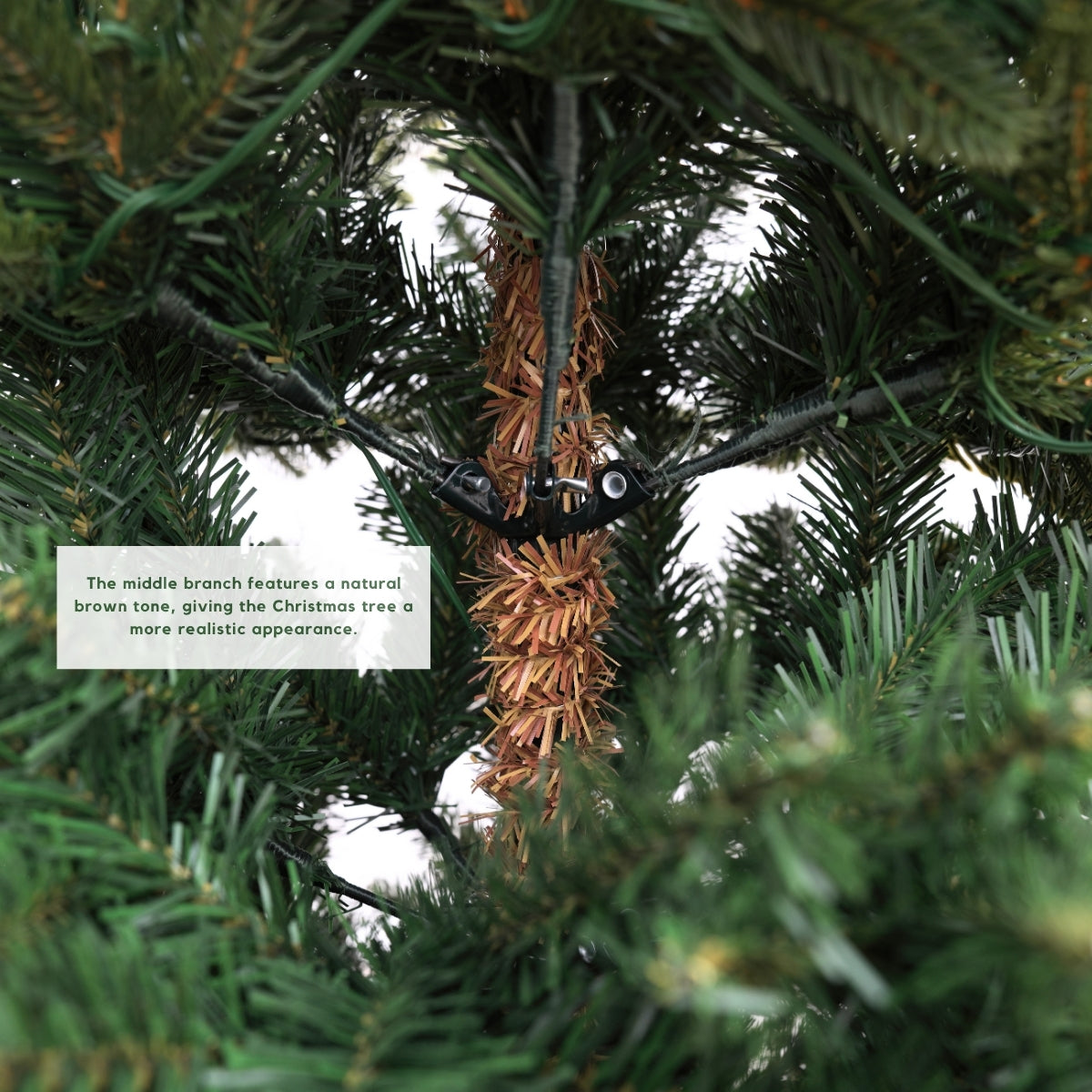 Close-up of the easy hinged branch assembly system, illustrating quick setup of a space saving, realistic Christmas Tree Singapore perfect for HDB flats.