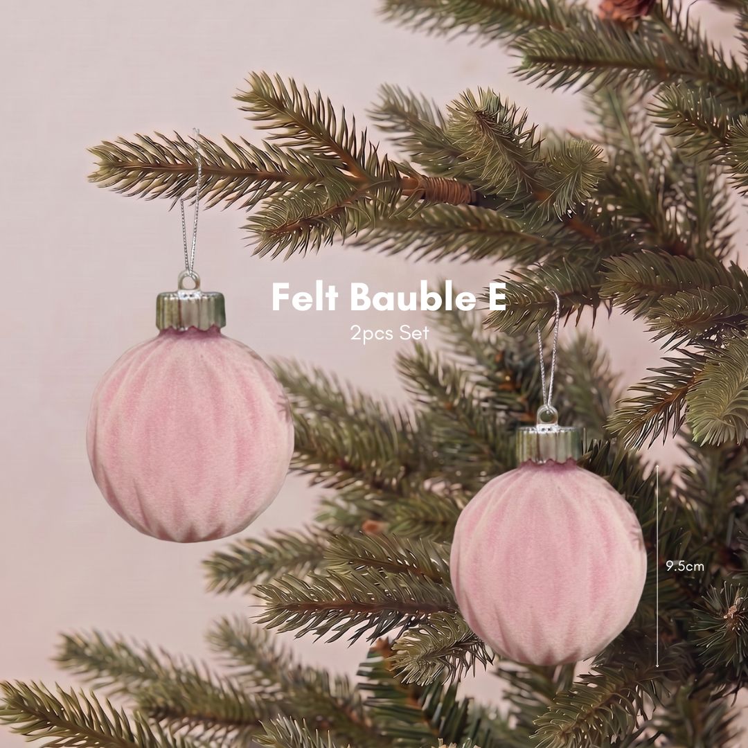 Close-up of a premium blush pink velvet Christmas bauble featuring a smooth, non-glitter finish for elegant Christmas tree styling in Singapore.
