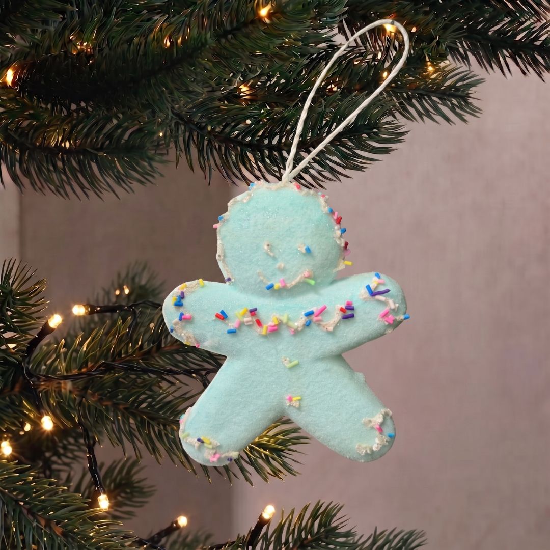 Candyland hanging gingerbread man ornament with pastel frosting details, styled as a whimsical Christmas decoration in Singapore.