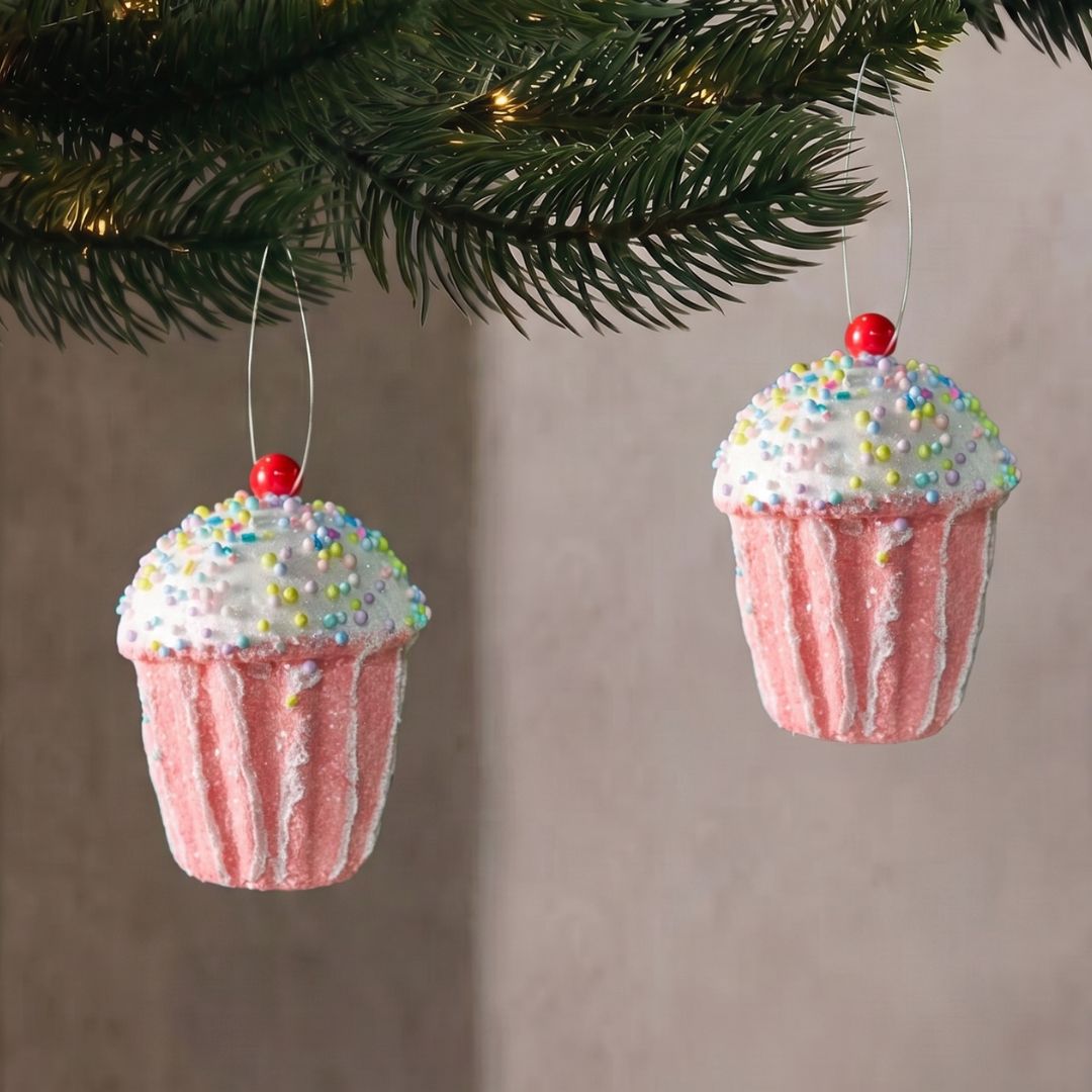 Candyland hanging pastel pink cupcake ornament with colorful sprinkles, styled as a whimsical Christmas decoration in Singapore.