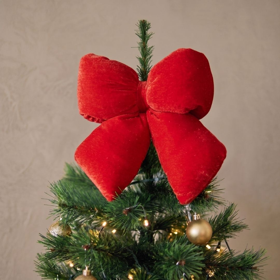 Candyland hanging red puffy bow ornament with a plush finish, styled as a bold Christmas decoration in Singapore.