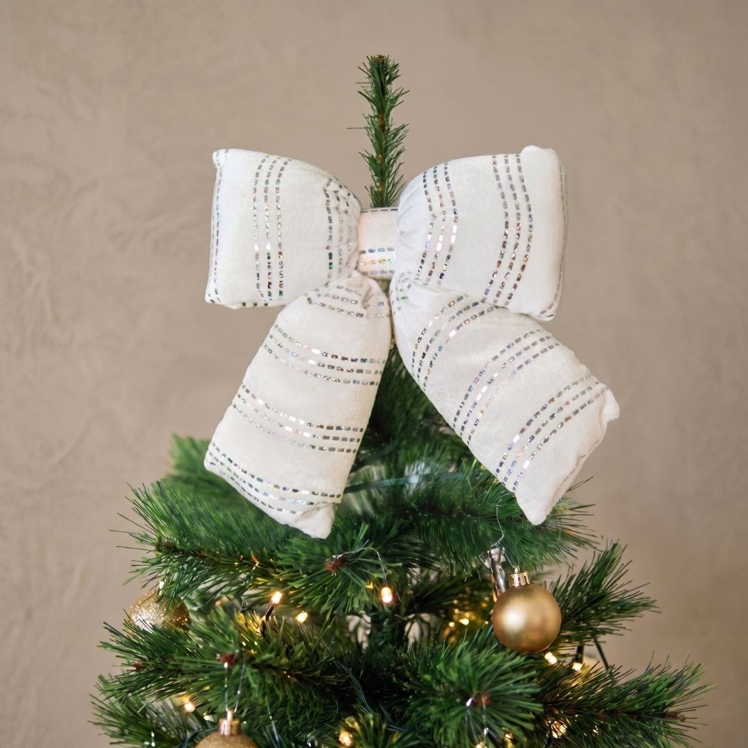 Candyland hanging white puffy bow ornament with silver shimmering stripes, styled as a whimsical Christmas decoration in Singapore.