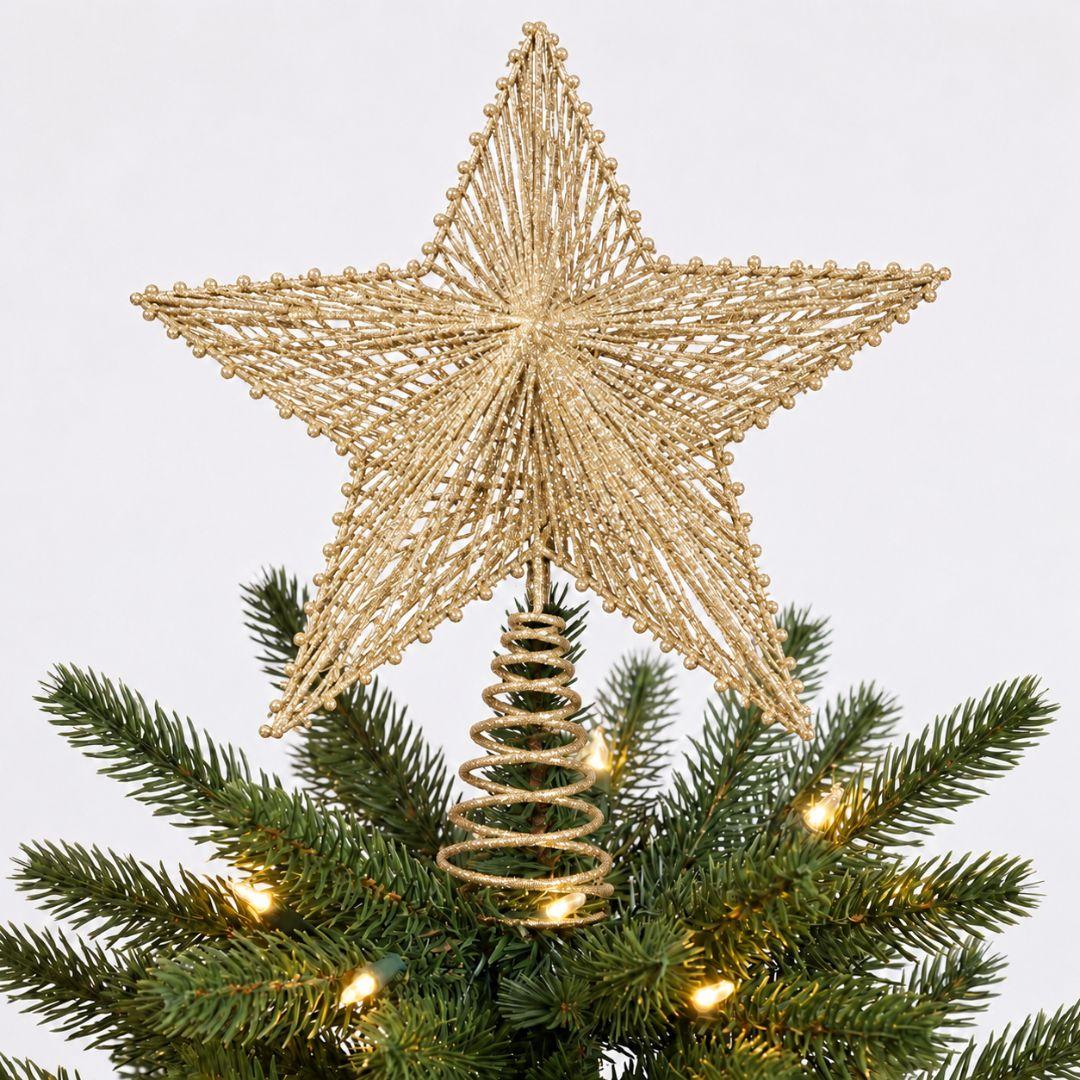 Champagne gold glitter star topper on an artificial Christmas tree with warm white festive lights