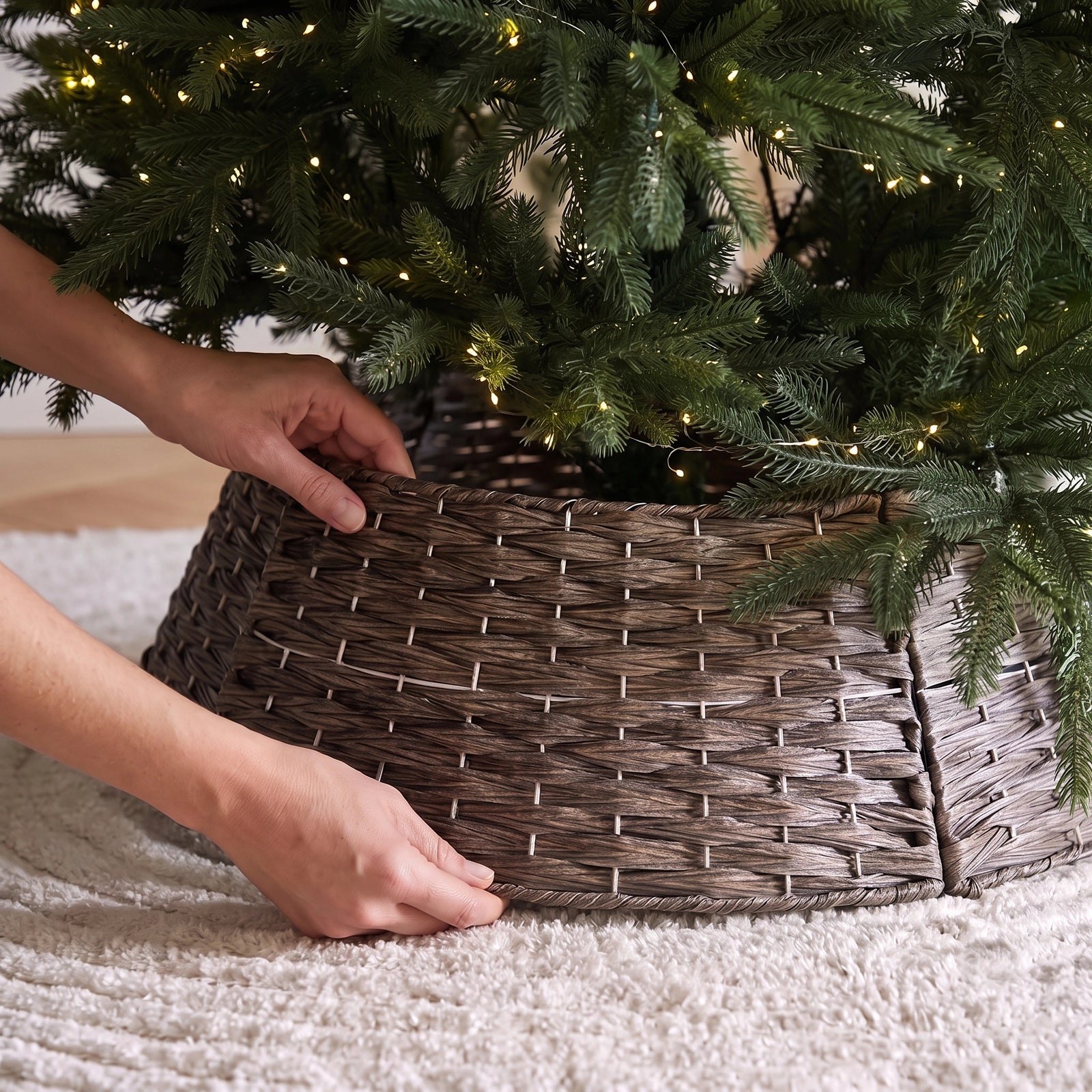 A stylish pvc wood like Christmas tree collar providing a neat and structured base for a lush, realistic christmas tree singapore.