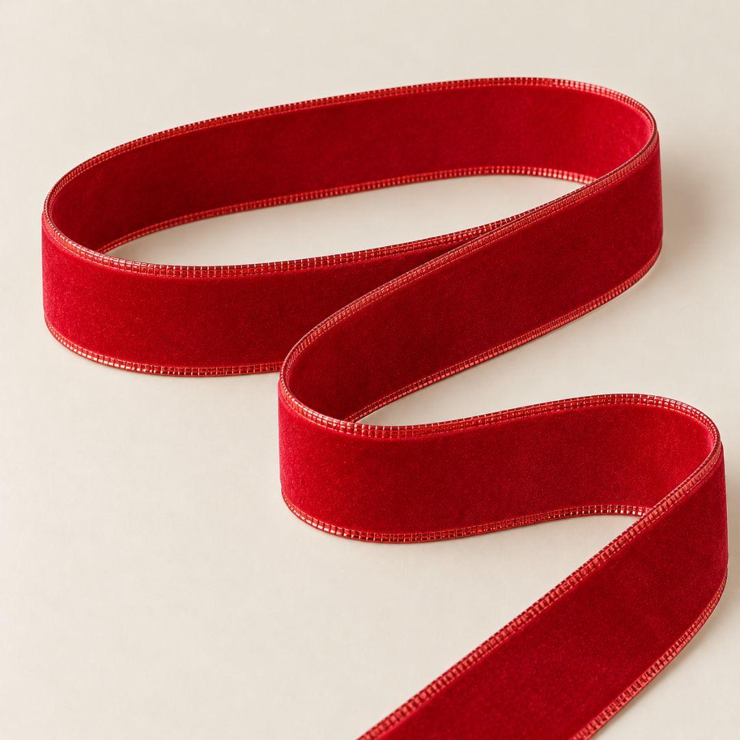 Classic red velvet-style Christmas ribbon with soft textured finish and wired edges, 5.5cm wide and 10m long, ideal for Christmas tree bows, wreaths and festive decorations.