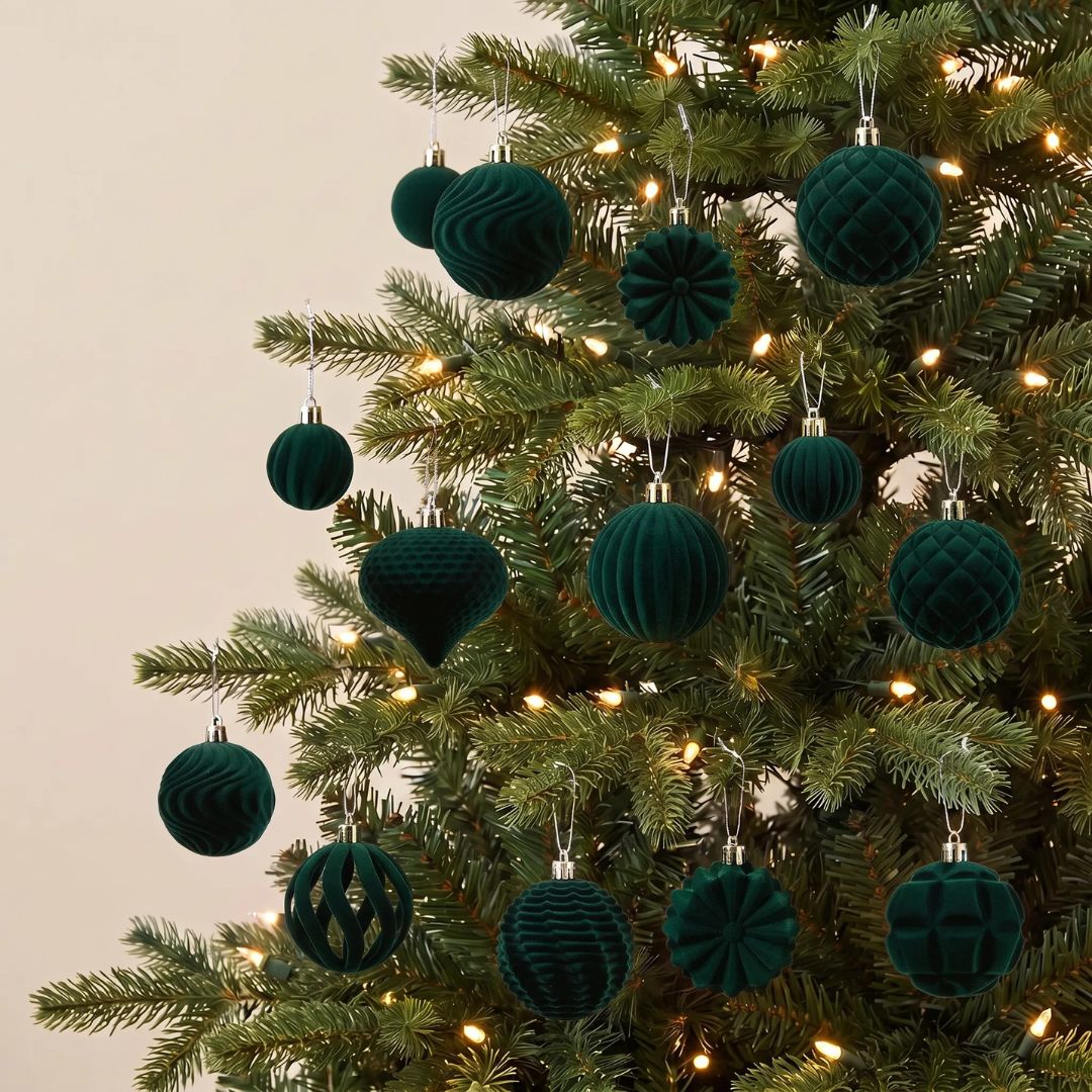 A boxed set of 48pcs glitter-free velvet plastic green Christmas baubles ranging from 4cm to 8cm.