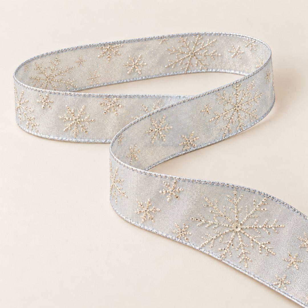 Icy blue Christmas ribbon with shimmering champagne snowflakes and glitter accents, 5.5cm wide and 10m long, ideal for Christmas tree bows and winter decorations.