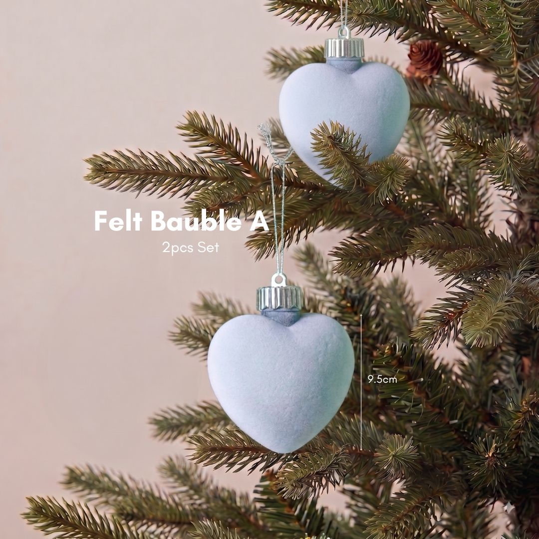 Minimalist and Scandinavian home interior in Singapore styled with premium artificial Christmas trees and elegant light blue velvet Christmas decorations