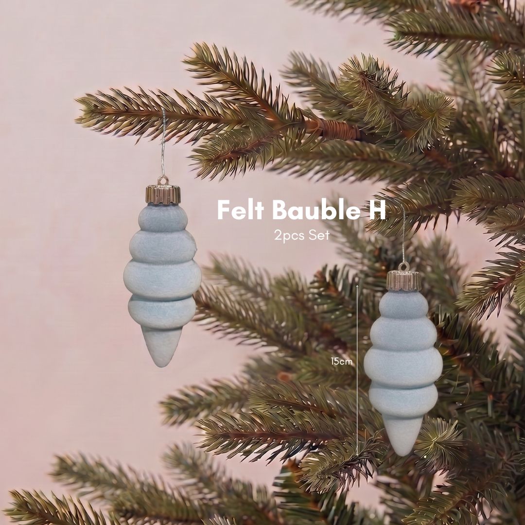 Close-up of a premium light blue velvet Christmas bauble featuring a smooth, non-glitter finish for elegant Christmas tree styling in Singapore.