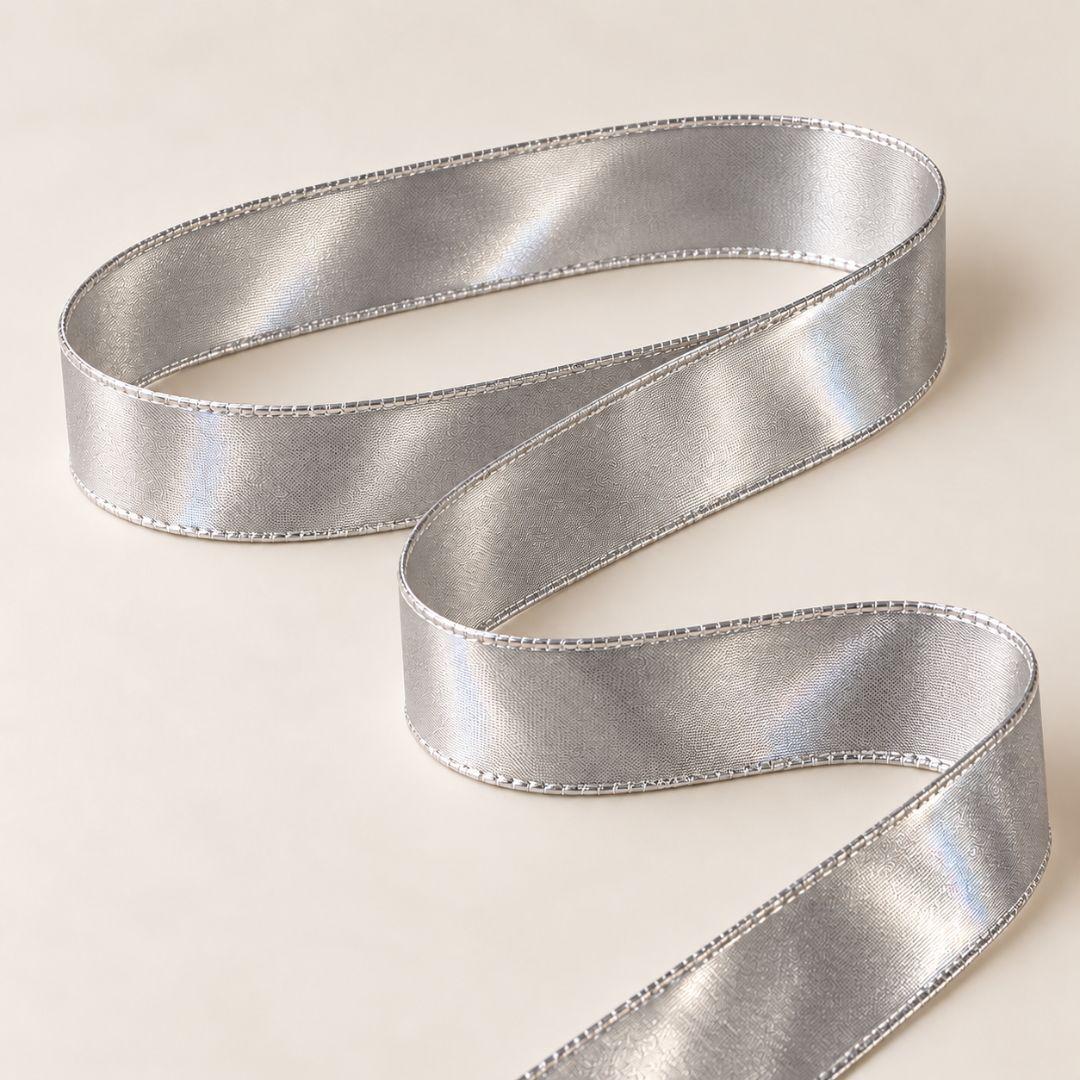 Metallic silver Christmas ribbon with a subtle textured pattern and shimmering finish, 5.5cm wide and 10m long, perfect for Christmas tree bows, wreaths and festive decorations.