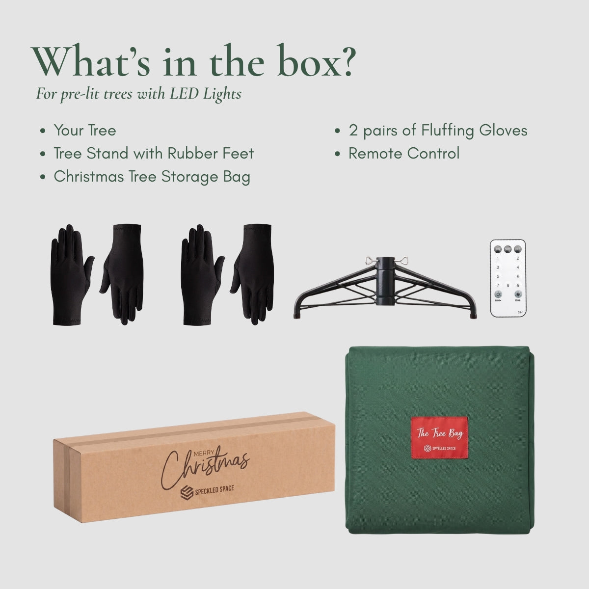 An open cardboard box revealing the neat contents of a premium artificial Christmas tree delivered in Singapore, including folded green branch sections, a sturdy metal stand, a power adapter, and an instruction manual