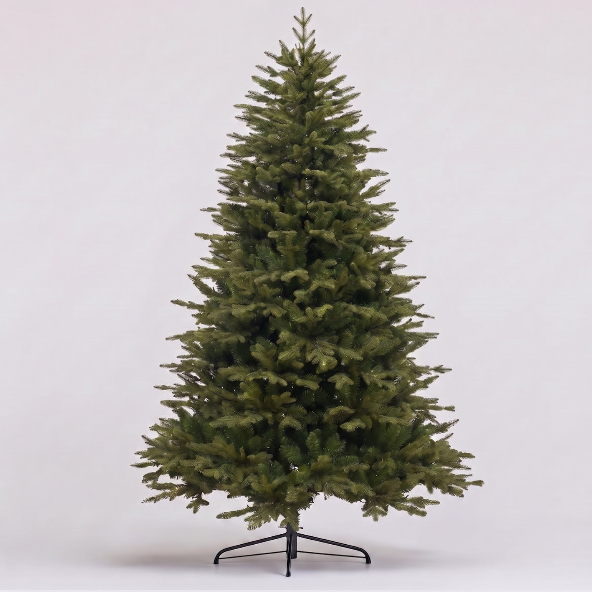 A grand Natale Fraser Fir Pre-Lit LED Christmas Tree fully decorated in a warm, festive Singapore home, showcasing a classic look