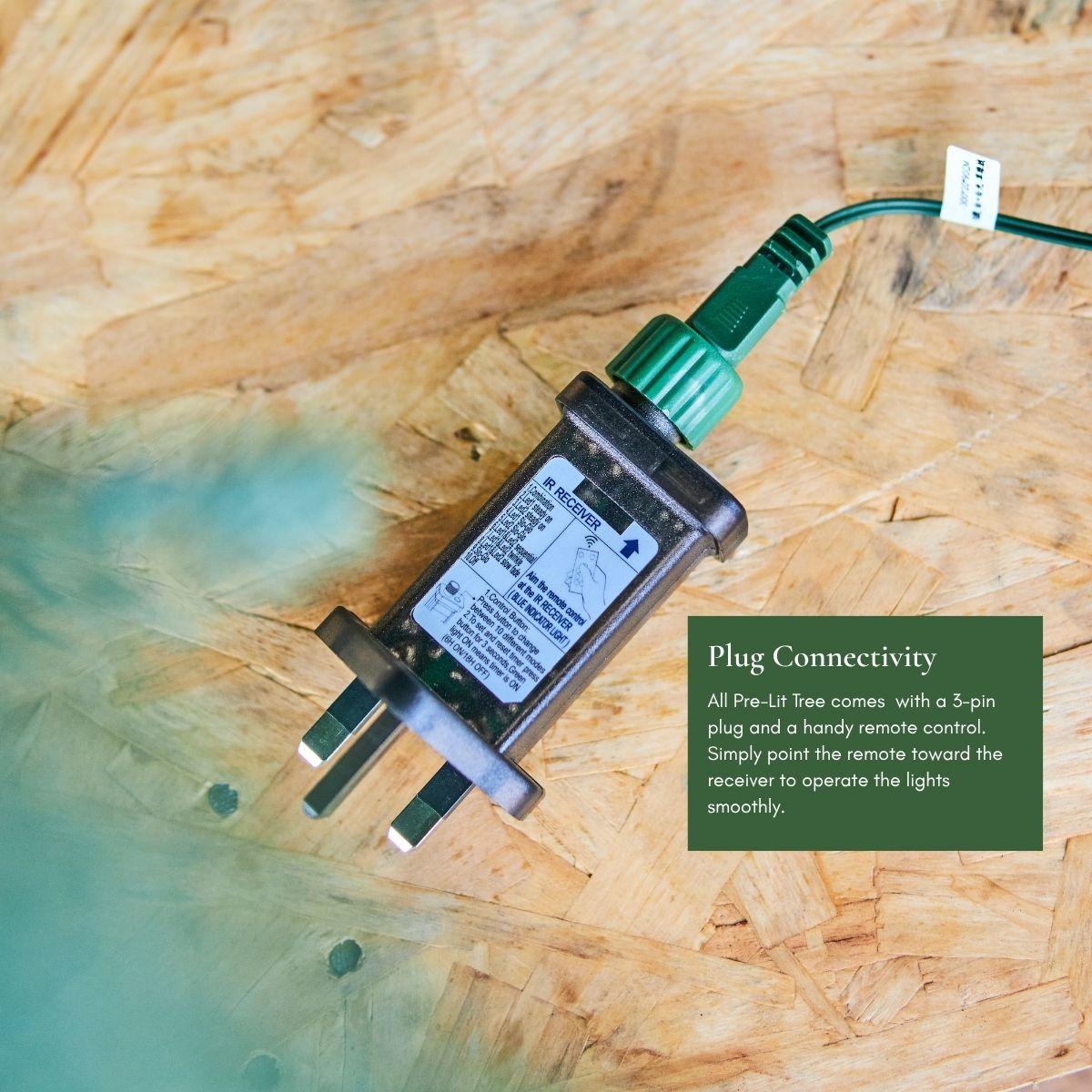 Image demonstrating the Plug and Play easy connection system on the Natale Fraser Fir Pre-Lit LED Christmas Tree, showing the central pole with a built-in power link for instant holiday magic in Singapore.