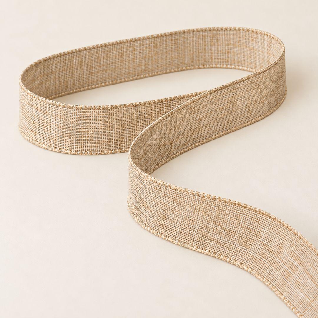 Natural beige linen-style Christmas ribbon featuring a textured woven finish and decorative stitched edges, ideal for Christmas tree bows, wreaths and festive gift wrapping.