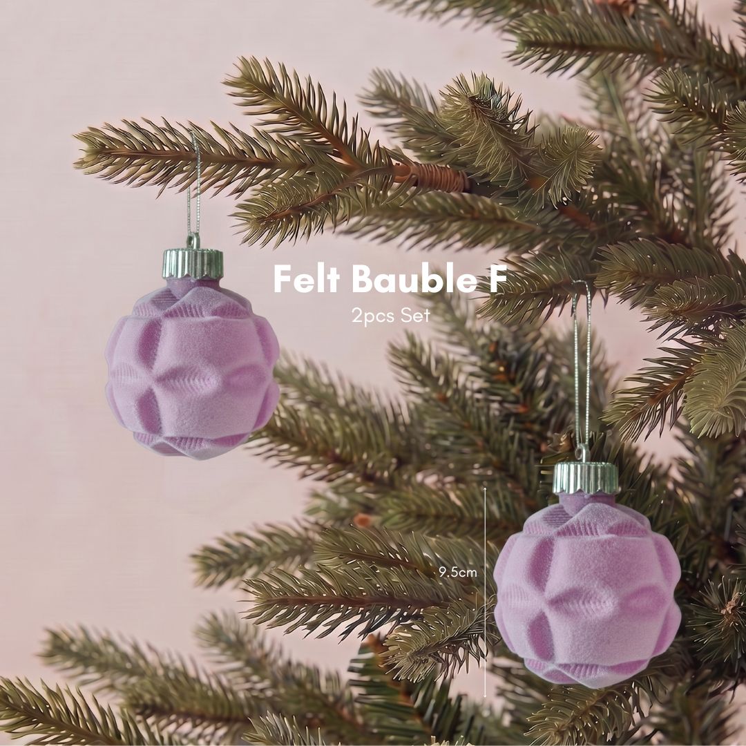 Close-up of a premium purple velvet Christmas bauble featuring a smooth, non-glitter finish for elegant Christmas tree styling in Singapore