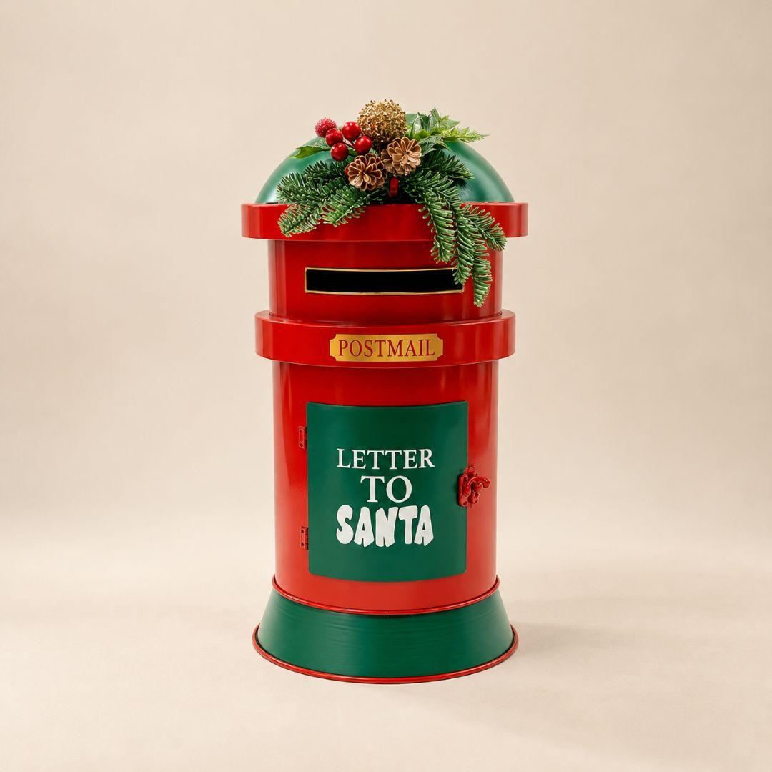 Santa Mail Letterbox metal Christmas mailbox in red and green with festive pine greenery and Letter to Santa design on a beige background