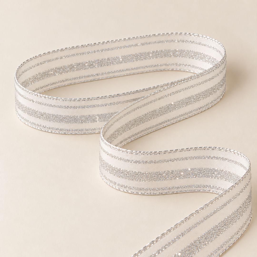 White and silver striped Christmas ribbon with shimmering silver glitter detailing and wired edges, 5.5cm wide and 10m long, ideal for Christmas tree bows and festive decorations.