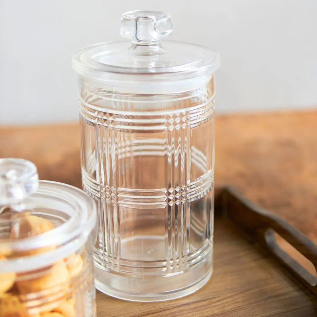 Speckled Space Ariel air-tight acrylic canister with clear body and lid for storing dry goods in kitchen.